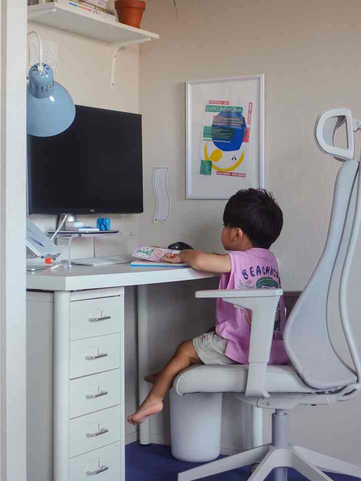 White and blue toned kids' room home office featuring a desk and office chair in a neat, compact setup