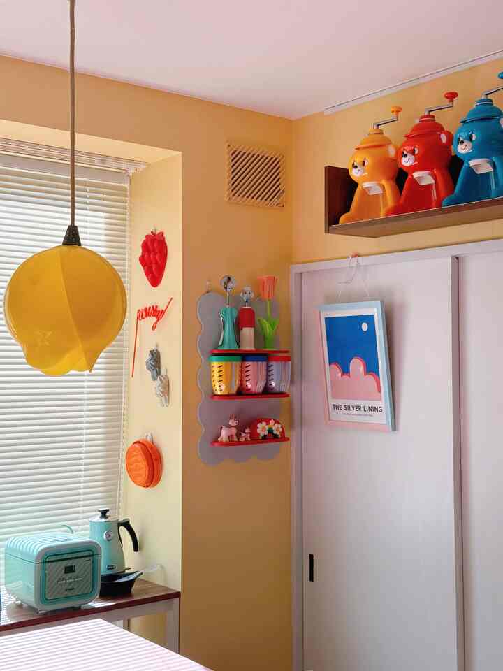 Warm yellow-toned kitchen space featuring vintage appliances and kitchen utensils near window, creating a cozy home cafe atmosphere