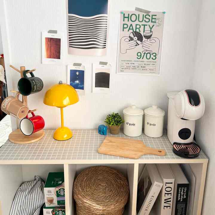 Bright white wall and natural wood-toned accents in a cozy kitchen-style home cafe setting