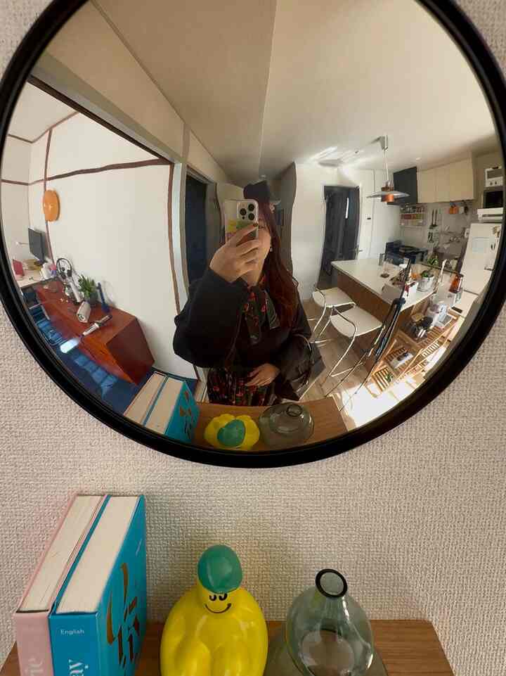 White and wood tone 2-person household 2LDK living room and kitchen reflected in a Mid-Century Modern Korean interior space