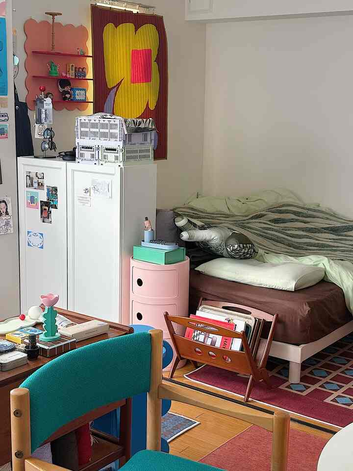 Pastel-toned vintage-style studio bedroom with cozy and efficient storage and layout