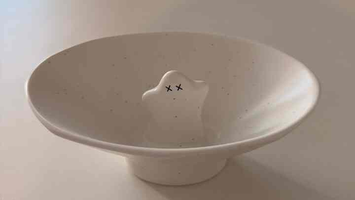 Simple white-tone ceramic bowl featuring a cute ghost shape in the center with a minimal aesthetic