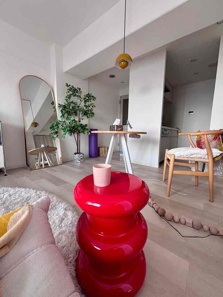 White and wood tone dining room for a single household, featuring simple and natural furniture creating a cozy atmosphere