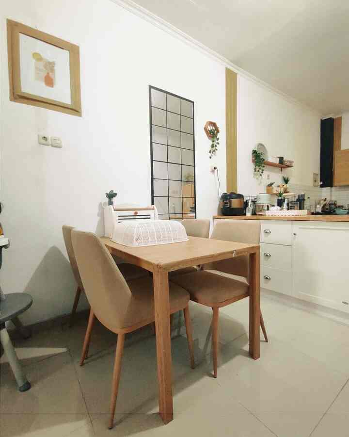 White and wood tone cohesive open space dining room and kitchen featuring minimal, simple Japandi style interior