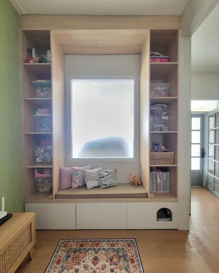 This room was originally a children's room, but when we had a little money for a small renovation, we finally tore down the wall and made a window nook. 

Why a window nook? Because my mother's dream since she was little was to be able to sit at the window and daydream 😆 I've always dreamed of having a one-one day and thank God it came true even though it wasn't as perfect as my mother imagined. 

Now because the children's room was moved to a narrower room above, this room automatically became filled with things and toys. Finally, we customized the window nook to be able to accommodate things and toys plus hidden storage for additional space. 

We also made a small door for Keiko and Yoshi's litter box to go in and out so it wouldn't stick out and disturb the view 😁 

Because the budget was limited, so the materials we used were only wood + HPL.. I wanted duco so it would be stronger, but it turned out that the choice of materials from Taco was enough to meet my mother's expectations. 

For the floor, we chose vinyl with the same color for 1 floor. The one we use is 2mm, because the previous vinyl niban was the same size. #MaterialWindowNook #InspirasiWindowNook #WindowNook

