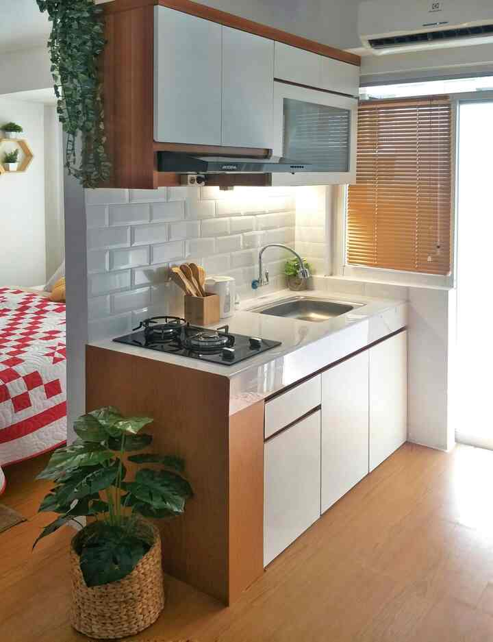 Minimal 2-meter kitchen space featuring white and wood tones with a clean and simple design aesthetic