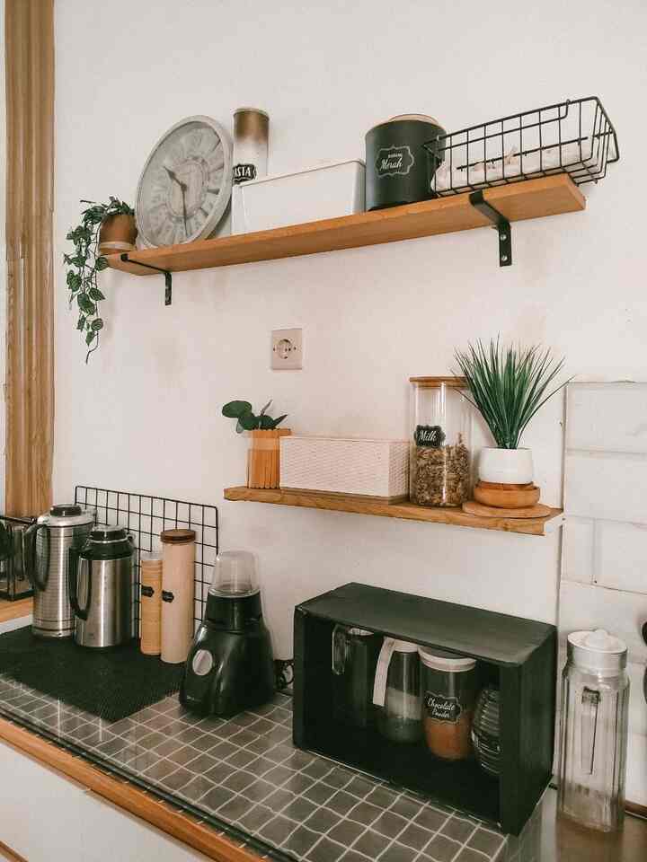 Natural color and wood tone kitchen featuring neatly arranged shelves and kitchen utensils with warm atmosphere