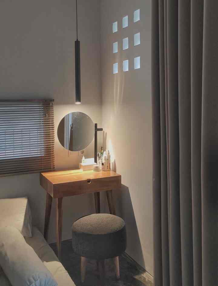 Warm wood tones and white bedroom vanity space with a minimalist, cozy atmosphere