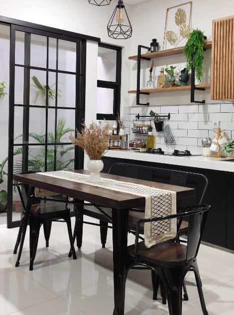 Area dapur dan ruang makan rumah.woori berkonsep industrial. Aksesoris di dapur agar sesuai dengan tema, saya memilih warna hitam dan motif kayu, seperti rail, keranjang sutil, keranjang bawang dan rak bumbu. Untuk saya yang tipikal praktis, saya lebih suka aksesoris dapur dekat dengan kompor agar mempermudah saya ketika masak. Selain itu aksesoris di hambalan saya tambahkan tanaman artificial dan aksesoris metal agar sesuai dengan konsep industrial. 
Untuk area ruang makan dipercantik dried flower vase dengan table runner warna soft dengan aksen warna hitam untuk mempertegas konsep industrial. Pemilihan peralatan makan saya berusaha konsisten semua berwarna putih dan bening agar terlihat simple dan gampang untuk mix n match. 

#rumahwoori #dapurindustrial #dapurmodern #modeldapurcantik  #inspirasidapur #kitchenset #industrial #ruangmakan #mejamakanindustrial  #ruangmakanindustrial #inspirasiruangmakan #tablerunner #taplakmeja #driedflower #bungakering #aksesorisdapur #aksesorismejamakan #peralatanmakan

