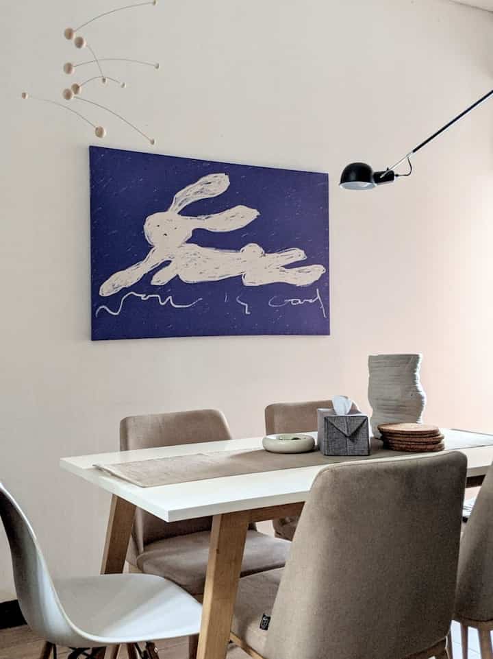Since my dining room is connected to the kitchen, surface areas such as tables and table tops quickly fill up, so for decoration I focused more on the walls and ceiling so that they can reflect the view upwards and make the room seem more spacious. 

I installed some artwork and statement lights and also mobile decorations on the ceiling area to draw the view to the upper area of the room. 

For the surface area, I chose to keep it neat, coincidentally the items in the kitchen are already the same color so they only need to be arranged. I also used some decorative objects such as vases and decorative bowls to store items that are less eye-pleasing

#Dining Utensils #InspirasiRuangMakan #MinimalistDiningTable #Artwork #Vas #DiningChair #Lamp #MobileArt #DecorativePlates