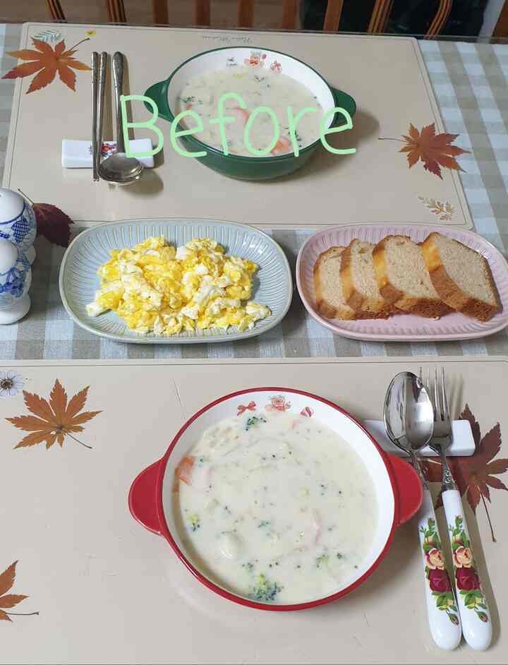 ベージュと赤のトーンが調和するキッチンのダイニングテーブル、丸い皿とテーブルクロス上に整えられた食器セットが配置された印象的な空間