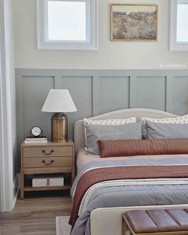 Natural and brown tone bedroom featuring a bed, nightstand with table lamp, creating a cozy atmosphere