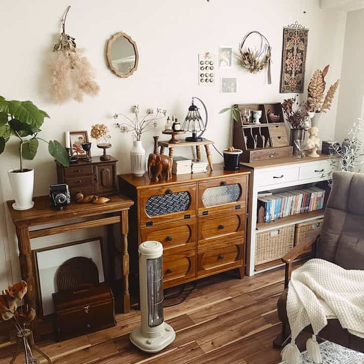 Natural color toned retro living room featuring wooden furniture and decorative objects creating a cozy atmosphere