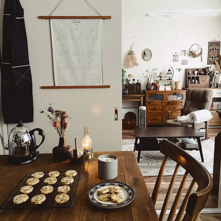Natural tones and vintage wooden furniture in a cozy two-person kitchen-living space
