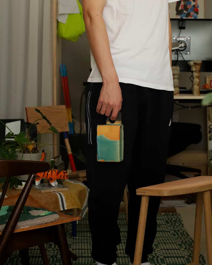 Natural wood tone and beige compact living room featuring diverse furniture and toys in a cozy space