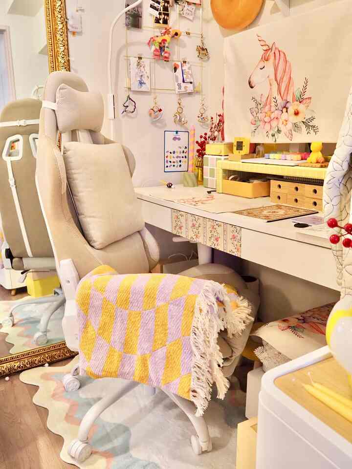 Light beige tone home office space featuring a simple desk and ergonomic office chair with a bright, cozy atmosphere