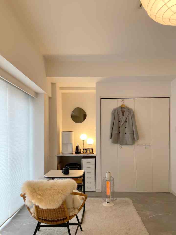 White-toned compact room featuring simple furniture and a home cafe area in a modern bedroom design