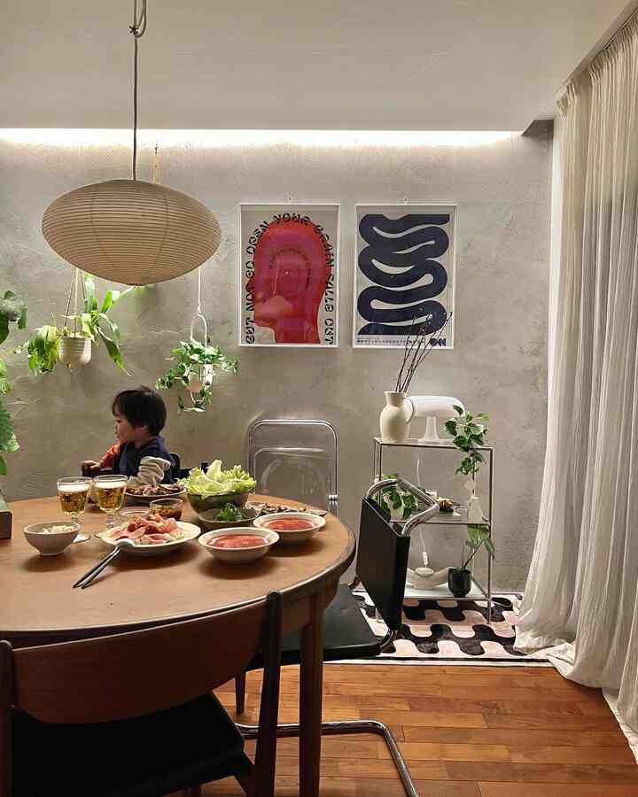 Natural color and wood tone dining room featuring a wooden dining table and pendant light creating a cozy atmosphere