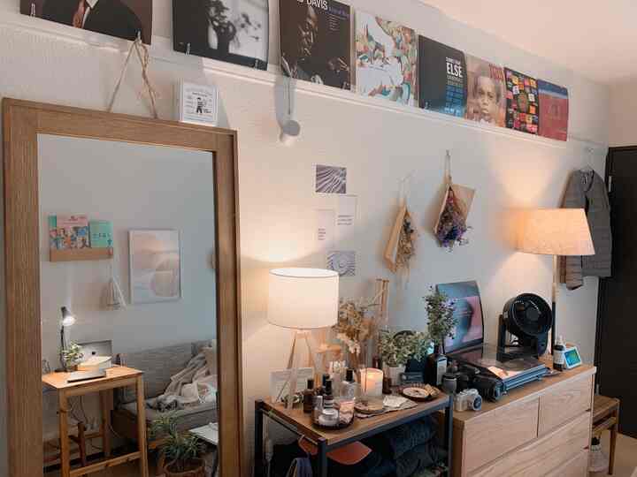 Warm natural-tone living room featuring wall decor and ambient lighting in a single household space