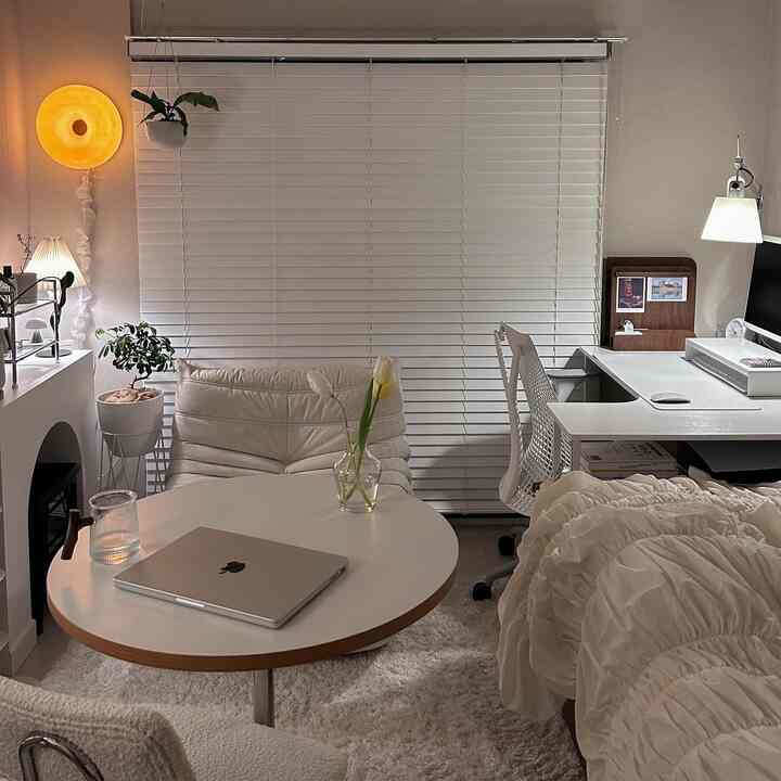 Natural wood tone and white home office combined with living area featuring cozy and clean atmosphere