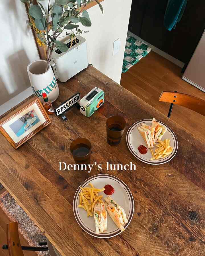 Cozy dining room with brown wooden table and vintage decor, featuring a home cafe atmosphere