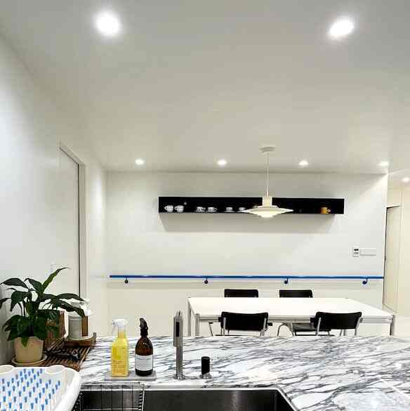 The marble tabletop and blue accent wall steal the show. 💎💙 #MarbleElegance #BlueAccents #InteriorDesign