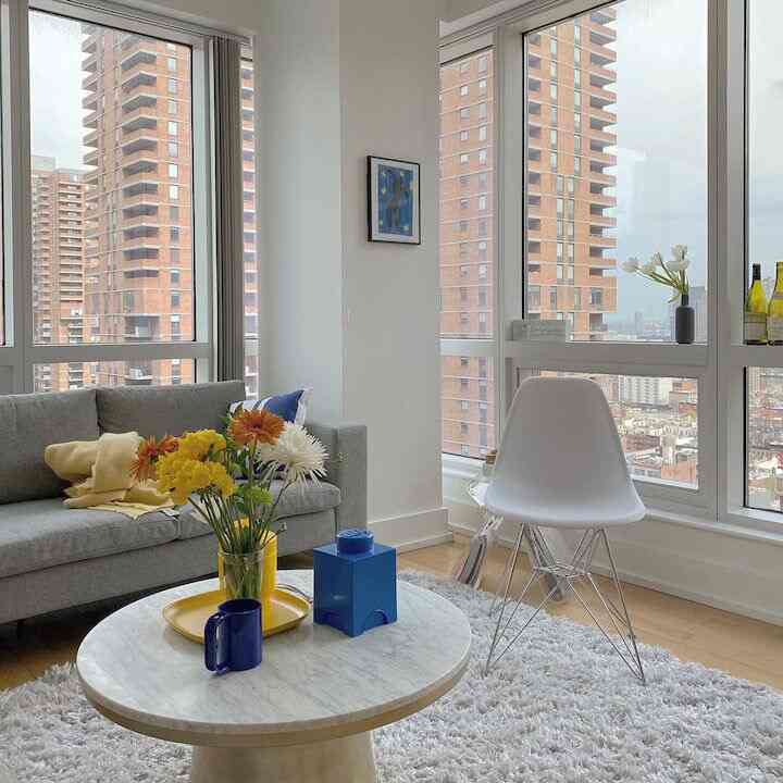 Adding a pop of color to a gray-toned living room with a high-rise view. 🏙️🌈 #GrayTones #ColorfulAccents #UrbanLiving