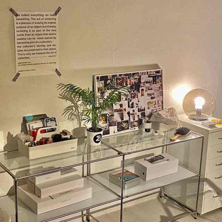 White and silver toned study featuring chrome shelves and white dresser creating a sleek atmosphere