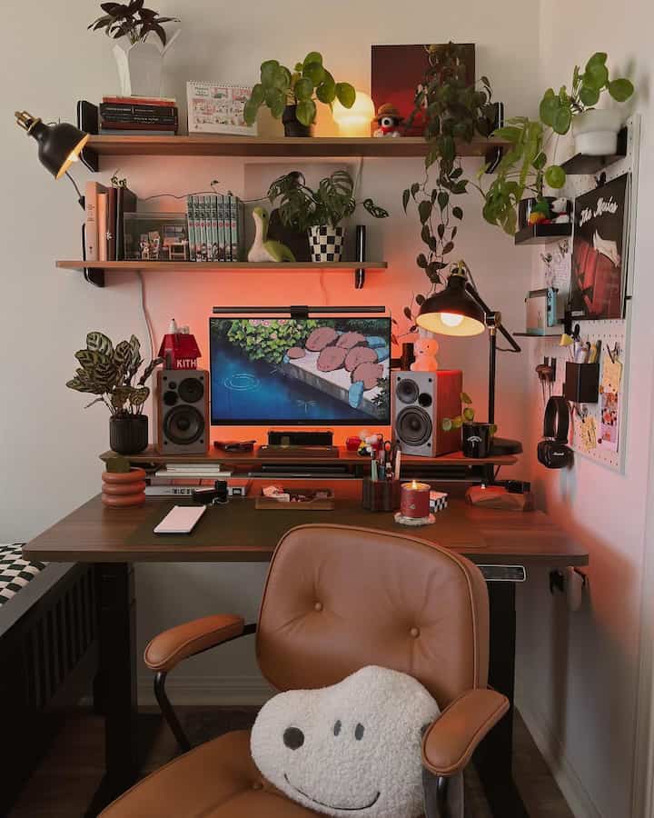 Warm-toned home office featuring brown office chair, wooden desk, and green plants with a cozy natural ambiance