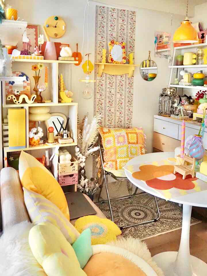 Bright yellow-toned cozy Korean Nordic living room featuring sofa, cushions, and pendant light in a charming space
