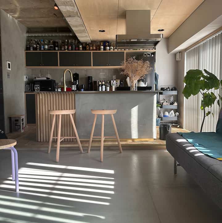 Modern kitchen and living room with natural wood and monotone colors, spacious and bright atmosphere