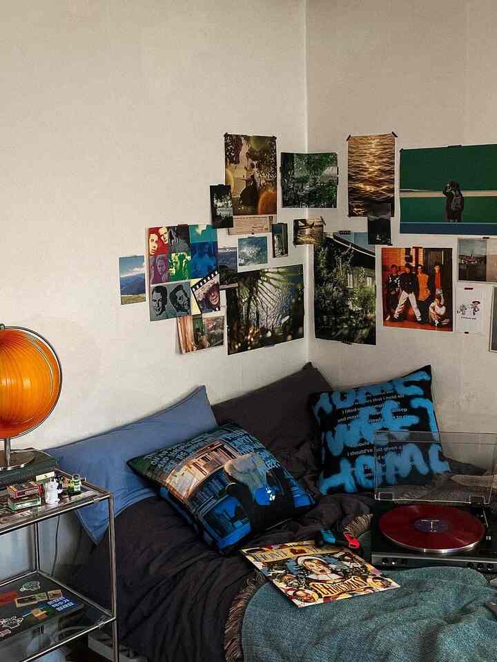 Cozy small bedroom with vintage orange lamp, bed, and retro record player setup