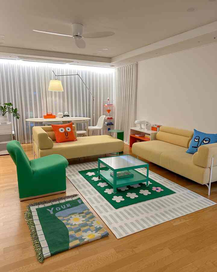 Natural color and white toned living room featuring yellow sofas and green chair with bright, natural atmosphere