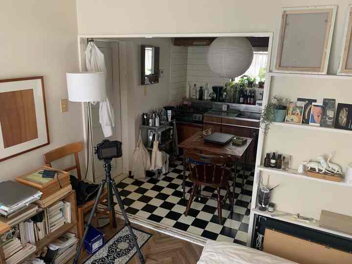 Compact apartment dining room with white and wood tones, featuring a natural modern style and simple cozy ambiance