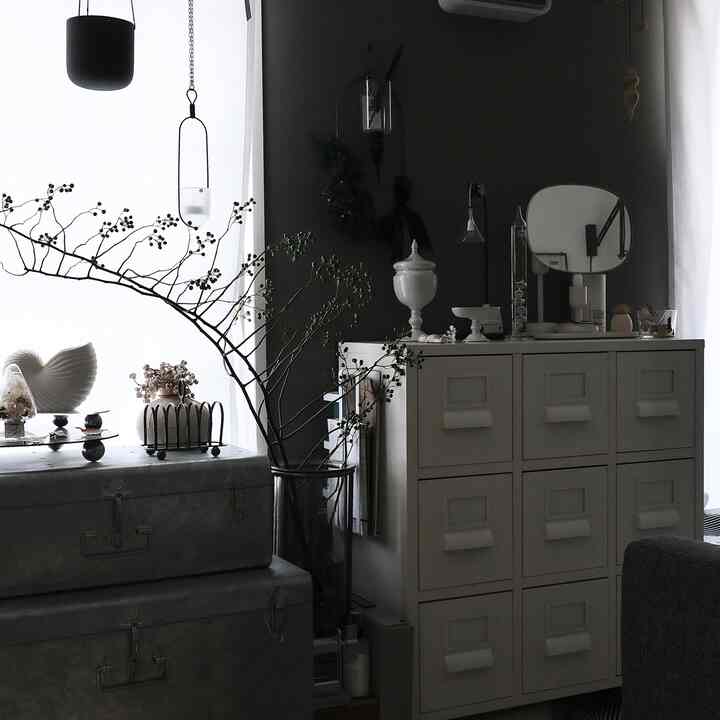 Monotone natural-toned living room featuring a white sideboard and organic decor items creating a calm atmosphere