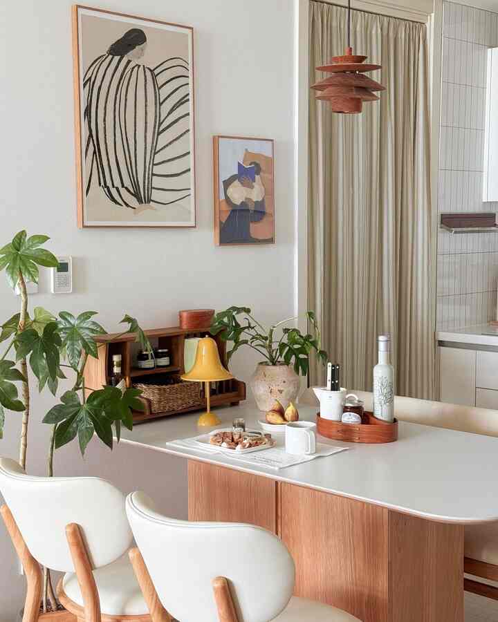 Natural modern kitchen and dining area with white and wood tones, featuring a clean and cozy atmosphere