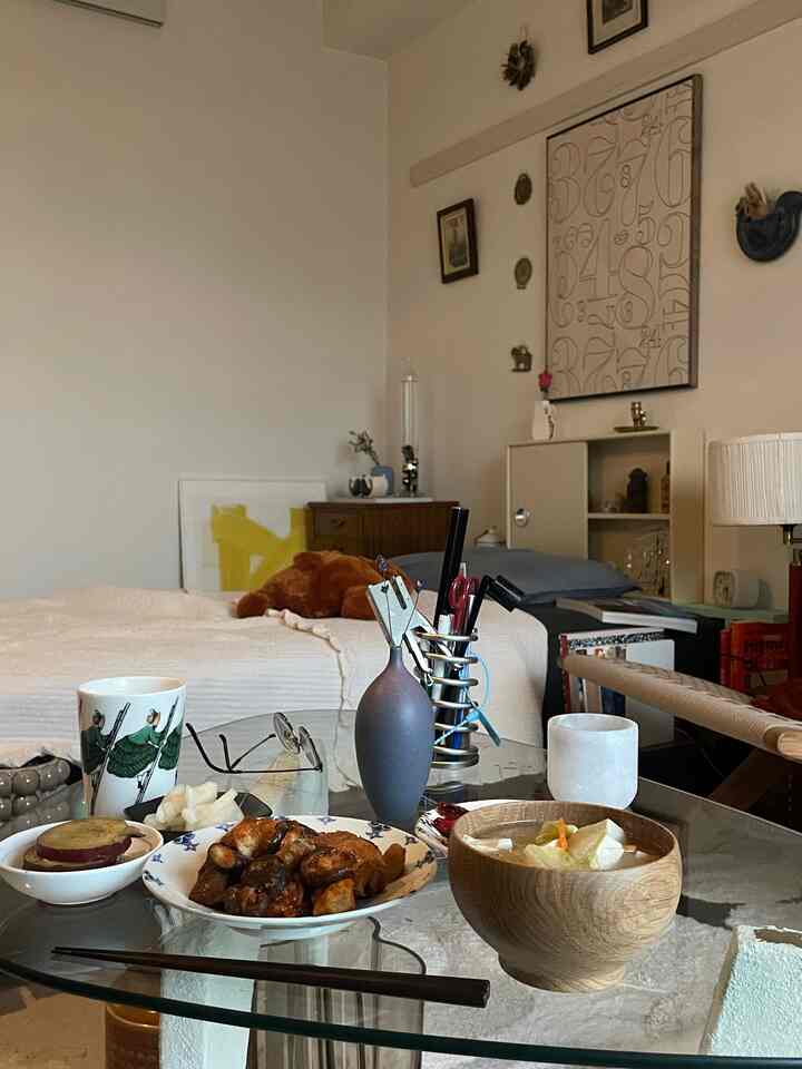 Brown and white toned single household living room featuring vintage furniture and cozy decor elements