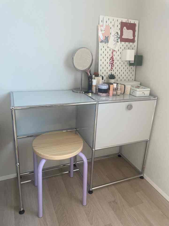 Minimal corner vanity space in white and wood tones, featuring clean design and neat arrangement