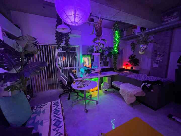 Purple and green toned single household home office with gaming room vibe, featuring modern industrial interior design