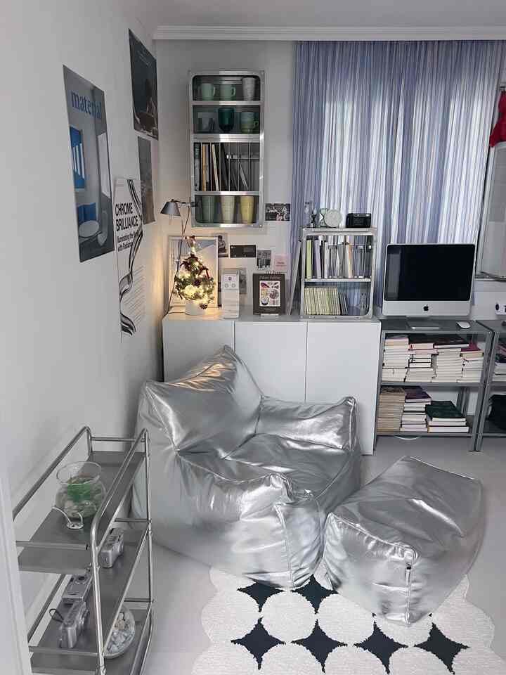 White and silver toned study space featuring silver bean bag and mini Christmas tree with a clean, modern atmosphere