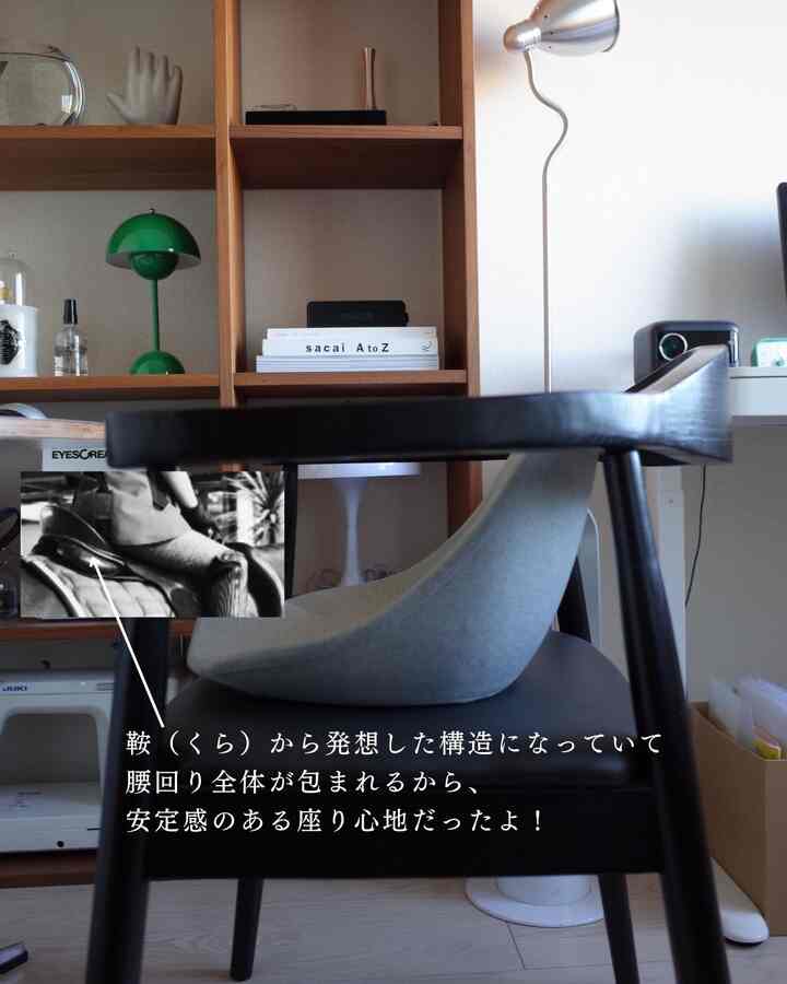 Wood tone and black accented home office space featuring a desk and office chair with a clean interior