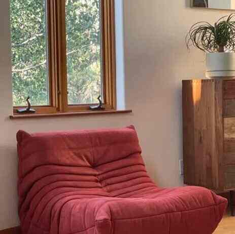 Soaking up the sunshine in my favorite trendy red lounge chair! ☀️❤️ Nothing like a little relaxation with a pop of color. #SunshineVibes #LoungeLife #BoldAndBeautiful #LoungeChair #ModernInterior #CozyDecor #Dupetogo #Togodupes