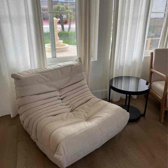 Embracing the warmth of bright wood and cozy vibes! 🌟🪑 This lounge chair is my perfect retreat in this serene space. #InteriorGoals #CozyCorner #Togodupes #Togo #LoungeChair #ScandinavianDesign #MinimalistDecor