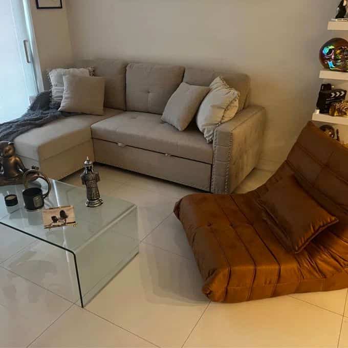 Celebrating the stability and comfort of my brown lounge chair! 🛋️✨ It's the perfect anchor in my space, bringing both style and relaxation. #ComfortZone #HomeVibes #LoungeLife #SectionalSofa #GlassCoffeeTable #ModernInterior #Togo #Togodupes 