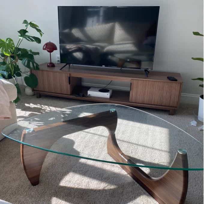 Loving this cozy setup with my wooden TV stand and matching coffee table! 🌳✨ Perfectly blending warmth and style in my living space. #HomeDecor #CozyVibes #MidCenturyModern #GlassCoffeeTable #TVStand