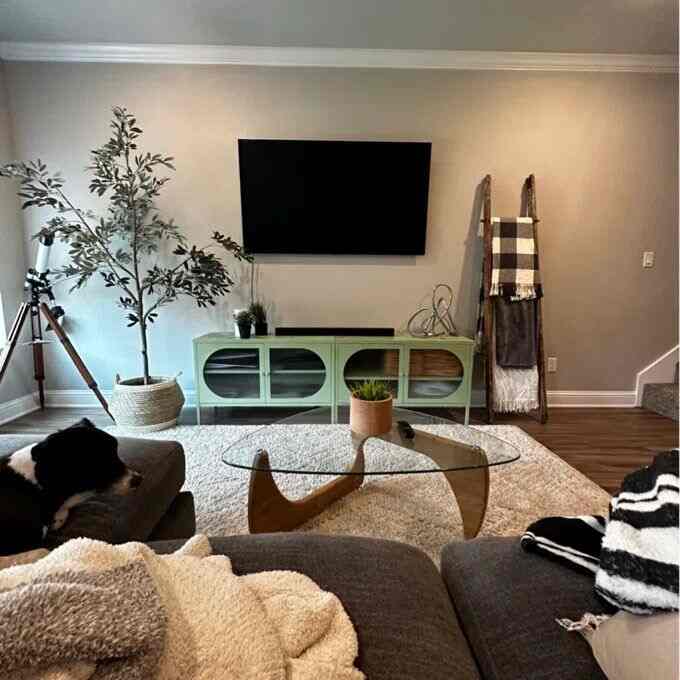 Cozy vibes with my wooden table in the heart of my home! 🪵🏡 Perfect for gathering with loved ones and making memories. #CozyHome #TableTalk #MidCenturyModern #GlassCoffeeTable #ScandinavianDecor #Hermanmillercoffeetable #Hermanmillerdupes