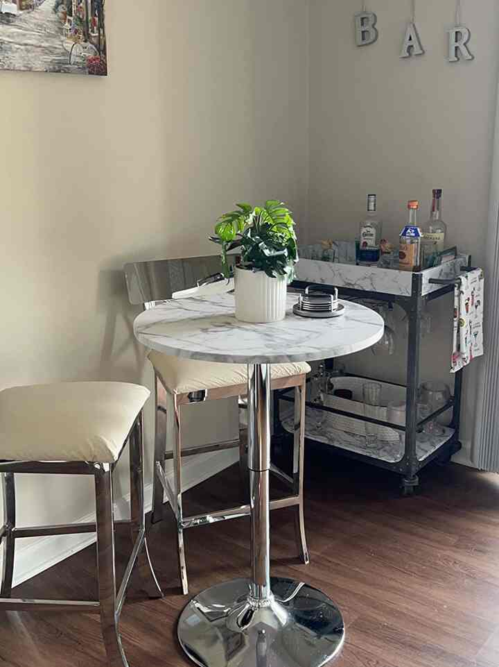 Sipping in style with this stunning marble bar table and matching bar cart! 🍸✨ The perfect blend of elegance and sophistication for my home bar. #MarbleGoals #HomeBar #ElegantInteriors #BarCart #BistroTable #ModernDecor