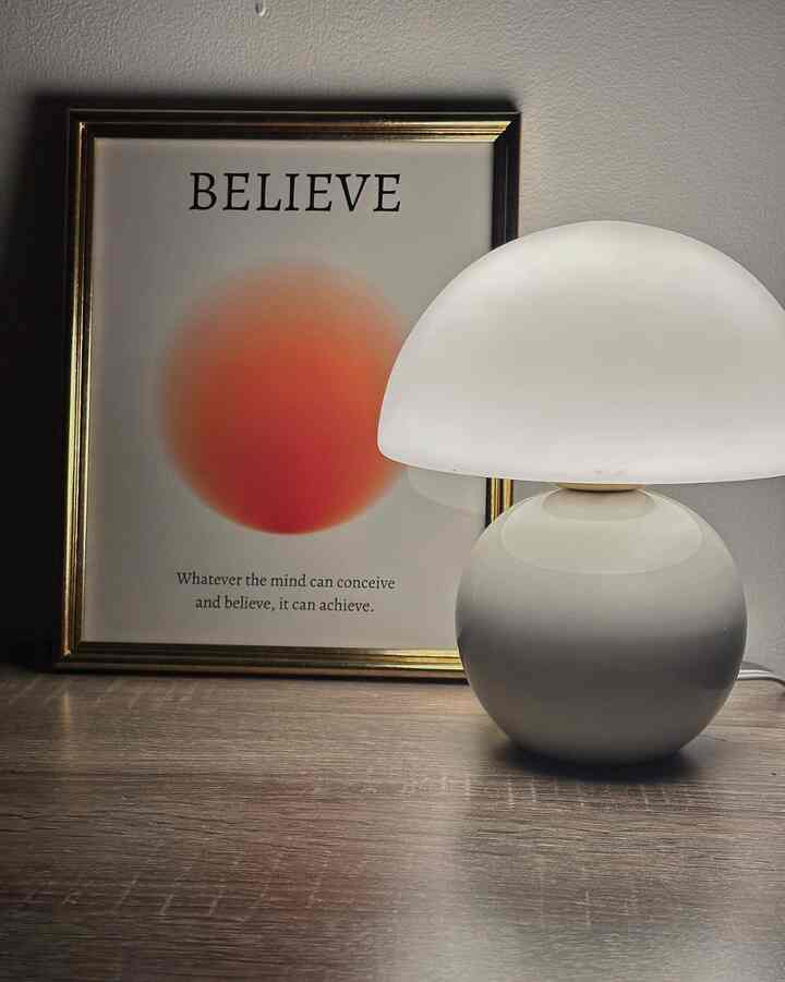 Transforming my space with this stylish painting and the soft glow of a moody white lamp! 🎨✨ A perfect combo to elevate my decor and inspire creativity. #ArtInspiration #HomeStyle #MoodLighting #MushroomLamp #ModernDecor #InspirationalArt