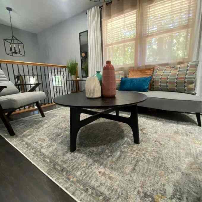 Chillin' in my sleek grey living room, where modern design meets ultimate comfort! 🛋️✨ Loving the calm vibes and sophisticated tones. #InteriorInspo #ModernLiving #CozyCorner #CoffeeTable #ModernDecor #AccentChairs