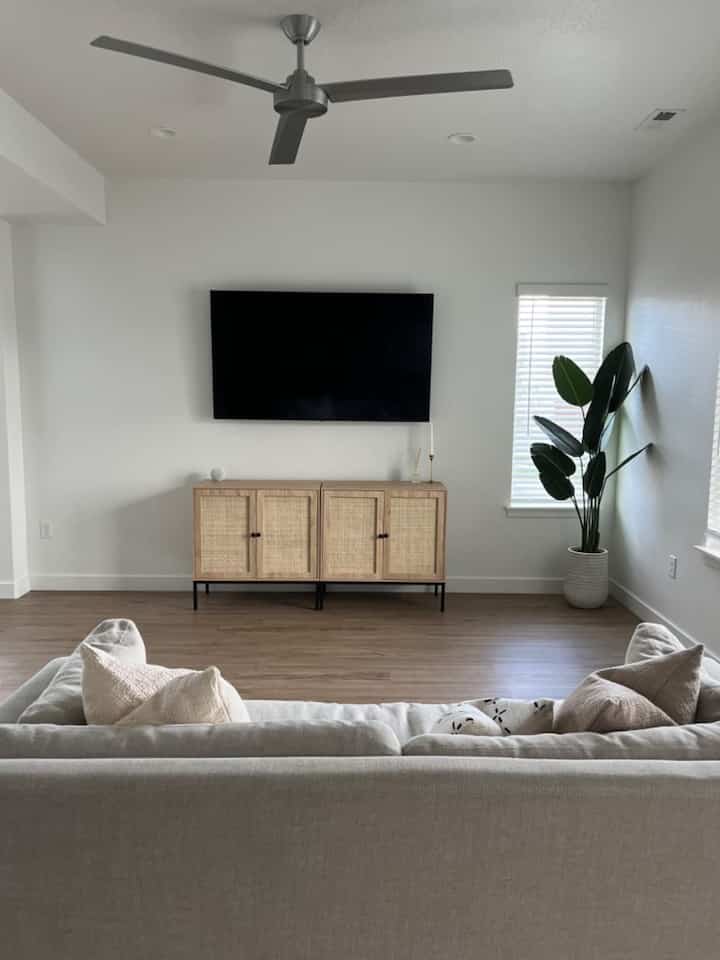Keeping it bright and cozy with this beautiful white interior! 🤍✨ My living room is the perfect spot to relax and unwind, filled with light and lovely textures. Who else loves a calm, inviting space? 🛋️🌿 #WhiteInteriors #CozyLiving #HomeSweetHome #MinimalistDecor #RattanCabinet #ModernLivingRoom